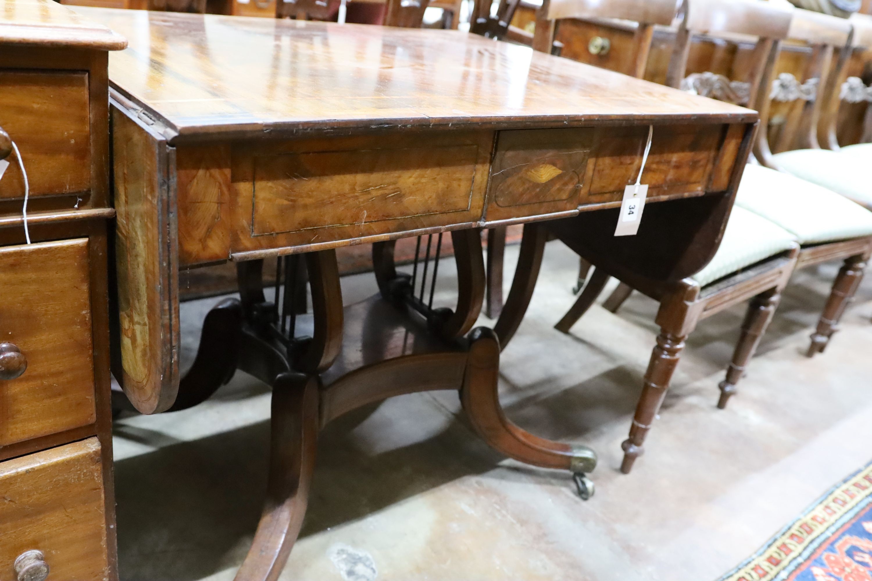 A Regency tulip banded mahogany sofa table, width 87cm, height 70cm